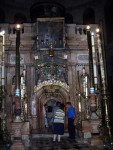 To the left of the mosaic, is what remains of the tomb.  Over the years,  much of the hill around the tomb has been cut away to allow creation of this church.   Here,  a small "house" is built covering the remembered tomb of Jesus.